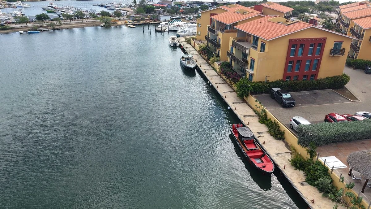 Aerial view of our red boat beside the dock