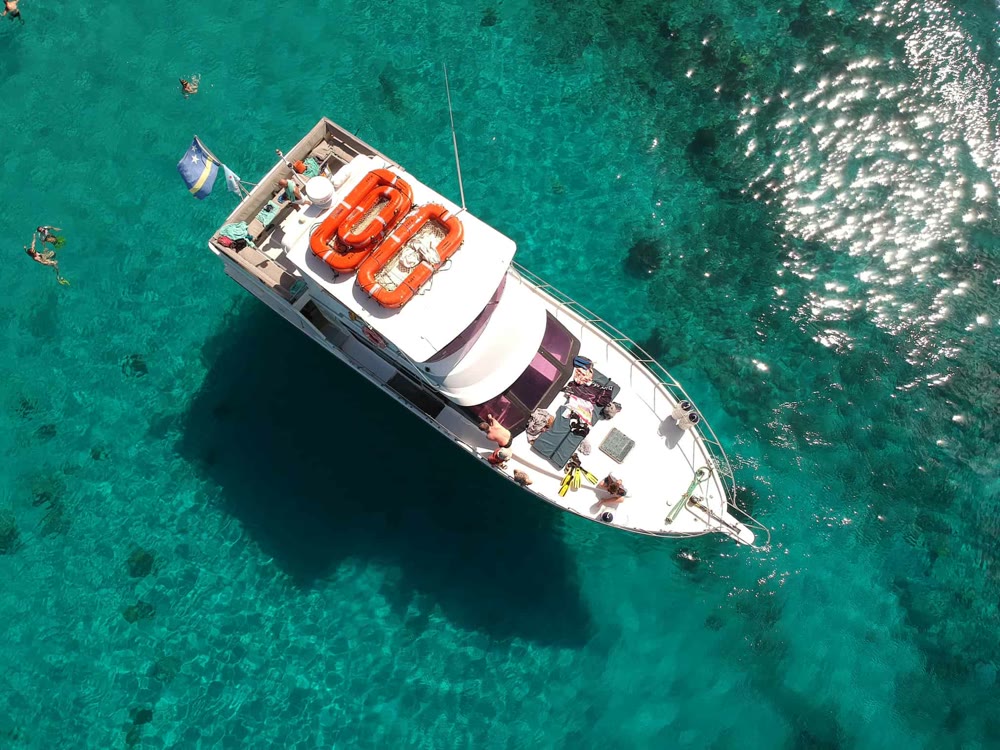 Motorboat viewed from above in turquoise water