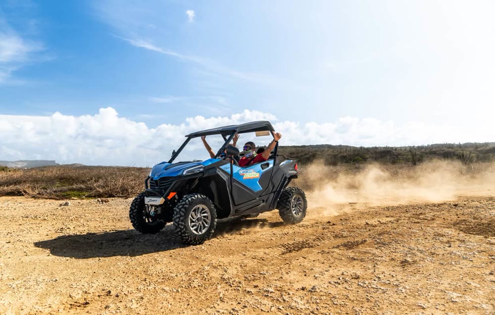 UTV crossing a dusty track